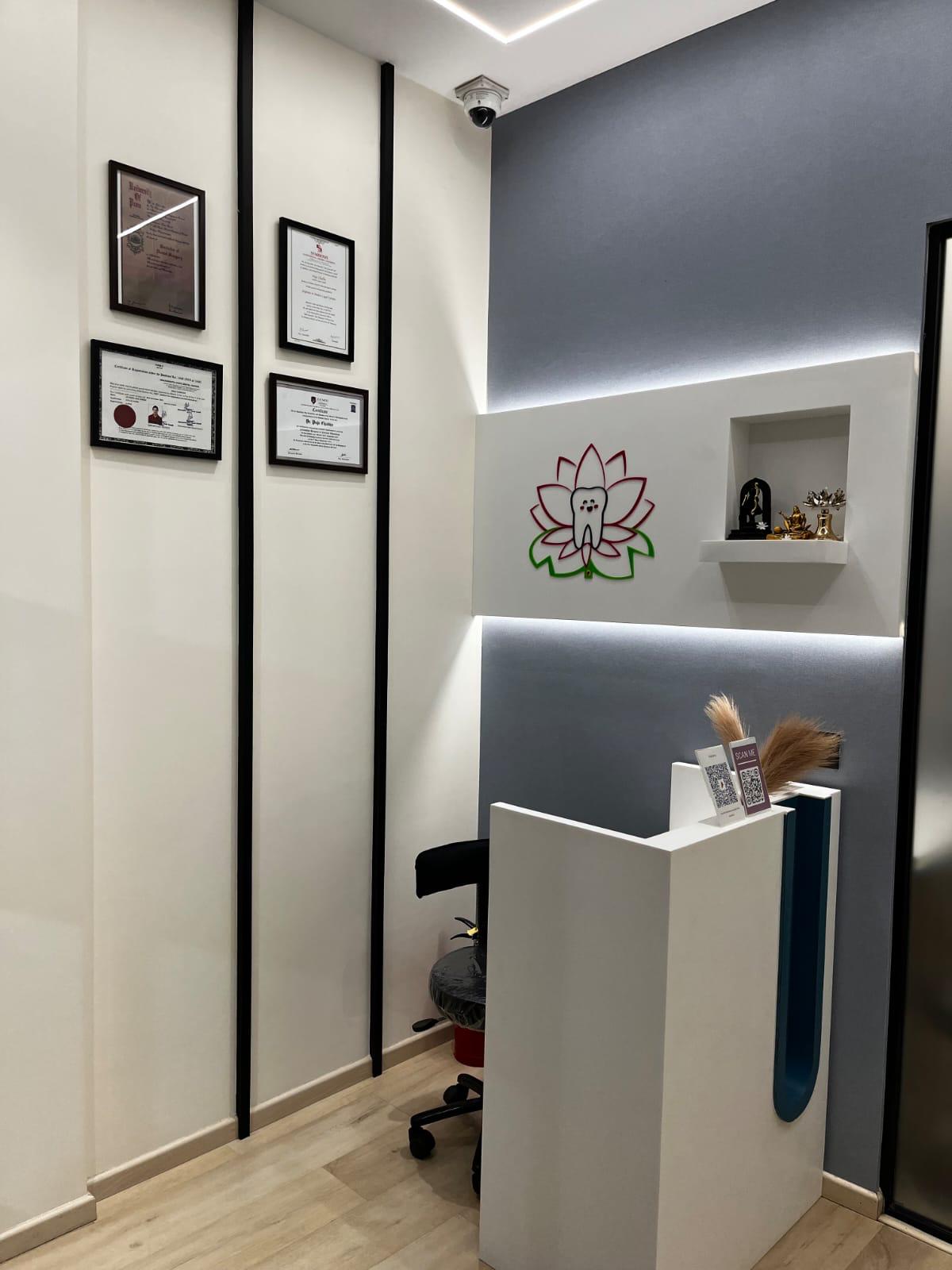 Reception area with Dr. Chadha's qualifications displayed on the wall